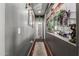 Hallway showcases gray walls, wood flooring, and decorative accents with view to the living room at 1849 S Balboa Dr, Gilbert, AZ 85295