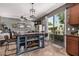 Open kitchen with an island bar, stainless appliances, and easy access to the living room at 1849 S Balboa Dr, Gilbert, AZ 85295