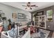 Comfortable living room featuring a neutral sofa and a decorative display cabinet at 1849 S Balboa Dr, Gilbert, AZ 85295