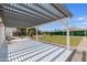 Open patio with white trellis, patterned flooring, and gravel, perfect for outdoor relaxing and entertaining at 1930 W Missouri Ave, Phoenix, AZ 85015
