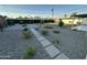 Expansive backyard featuring desert landscaping, a gravel area, and a dedicated fire pit at 1930 W Missouri Ave, Phoenix, AZ 85015