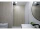 Walk-in shower features stylish tiling and a sleek rain shower head, next to toilet at 1930 W Missouri Ave, Phoenix, AZ 85015