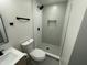 Recently updated bathroom with tiled shower, neutral walls, and modern fixtures at 1930 W Missouri Ave, Phoenix, AZ 85015