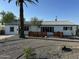 Well maintained exterior with desert landscaping and mature palm tree at 1930 W Missouri Ave, Phoenix, AZ 85015