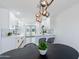 Stylish kitchen and dining area showcasing modern white cabinets and stylish pendant lighting at 1930 W Missouri Ave, Phoenix, AZ 85015