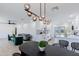 Spacious open-concept with stylish living room, dining area, and modern kitchen with white cabinets at 1930 W Missouri Ave, Phoenix, AZ 85015