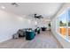 Bright and open living room featuring stylish furniture, large windows, and modern flooring at 1930 W Missouri Ave, Phoenix, AZ 85015