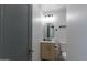 Stylish powder room featuring a modern vanity, sleek fixtures, and a convenient toilet at 1930 W Missouri Ave, Phoenix, AZ 85015