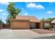Charming single-story home with well-maintained landscaping and a two-car garage in a sunny neighborhood at 19648 N 8Th Pl, Phoenix, AZ 85024