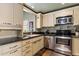 Well-lit kitchen features stainless steel appliances and granite countertops at 19648 N 8Th Pl, Phoenix, AZ 85024