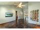 Spacious living room with vaulted ceilings, tile floors, and a ceiling fan fixture at 19648 N 8Th Pl, Phoenix, AZ 85024