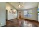 Bright living room features tile flooring, a large window, and a ceiling fan at 19648 N 8Th Pl, Phoenix, AZ 85024