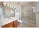 Bathroom featuring a single sink vanity and a shower over tub combination at 19662 N Overton Ct, Surprise, AZ 85374