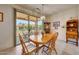 Dining room with glass sliding door and views of the back patio at 19662 N Overton Ct, Surprise, AZ 85374