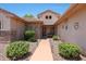 Inviting front entrance with walkway, desert landscaping, and stone accents at 19662 N Overton Ct, Surprise, AZ 85374