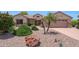 Charming single-story home with landscaped front yard and stone accents at 19662 N Overton Ct, Surprise, AZ 85374
