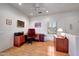 Office space with laminate wood floors, bright natural light, and recessed lighting at 19662 N Overton Ct, Surprise, AZ 85374