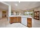 Bright kitchen with updated appliances and seamless flow to the living room at 19662 N Overton Ct, Surprise, AZ 85374