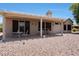 Inviting covered patio with outdoor seating area, perfect for entertaining at 19662 N Overton Ct, Surprise, AZ 85374