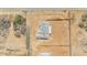 Aerial view of a new construction home site showing roof detail, utilities, and desert landscaping at 1969 E Long Rifle Rd, Phoenix, AZ 85086