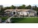 Beautiful one-story home featuring a manicured lawn, white exterior, and welcoming front porch at 1969 E Long Rifle Rd, Phoenix, AZ 85086