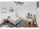 Stylish bedroom with patterned rug, iron bed frame, and eclectic decor at 21120 E Superstition Dr, Queen Creek, AZ 85142