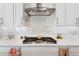 Bright kitchen features stainless steel appliances, white cabinetry, and a modern gas range at 21120 E Superstition Dr, Queen Creek, AZ 85142
