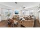 Bright living room with natural light, modern furnishings, and wood-look flooring at 21120 E Superstition Dr, Queen Creek, AZ 85142