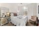 Bright bedroom with plush decor, a cozy bed with a soft throw, and a mirrored side table at 23083 N 74Th Pl, Scottsdale, AZ 85255