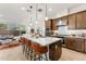 Bright kitchen featuring a large island, pendant lighting, and a seamless flow into the living area and outdoor patio at 23083 N 74Th Pl, Scottsdale, AZ 85255