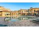Beautiful community pool surrounded by well-maintained buildings and plenty of seating at 23083 N 74Th Pl, Scottsdale, AZ 85255