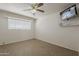 Bedroom features tile floors and a tv mounted on the wall at 2432 W Echo Ln, Phoenix, AZ 85021