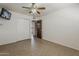 Bedroom with tile floors, closet and a door to additional rooms at 2432 W Echo Ln, Phoenix, AZ 85021
