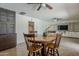 Spacious dining area with easy access to the kitchen and views of the built-in entertainment center at 2432 W Echo Ln, Phoenix, AZ 85021