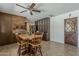 Comfortable dining area with views of the kitchen, stainless steel fridge, and access to backyard at 2432 W Echo Ln, Phoenix, AZ 85021
