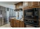 Functional kitchen with abundant cabinet space, modern oven, and sleek countertops at 2432 W Echo Ln, Phoenix, AZ 85021