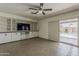 Living room with custom built-ins and a sliding glass door leading to the pool at 2432 W Echo Ln, Phoenix, AZ 85021