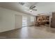 Open living room with a dining area and sliding glass door to the backyard at 2432 W Echo Ln, Phoenix, AZ 85021