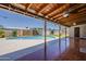 Large covered patio with wooden ceiling, ceiling fans, and a view of the backyard pool at 2432 W Echo Ln, Phoenix, AZ 85021