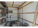 Utility shed with lawnmower and shelving for convenient garden tool storage at 2432 W Echo Ln, Phoenix, AZ 85021