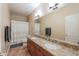 Bathroom featuring a double vanity, granite countertops, tiled floors and a shower with a tub at 2514 E Grand Canyon Dr, Chandler, AZ 85249