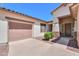 Attractive single-story home with stone accents and a two-car garage at 2514 E Grand Canyon Dr, Chandler, AZ 85249