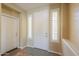 Bright foyer featuring tiled floors and a stylish front door with sidelight windows at 2514 E Grand Canyon Dr, Chandler, AZ 85249