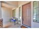 Cozy front porch with seating, decorative windows, and stylish front door at 2514 E Grand Canyon Dr, Chandler, AZ 85249