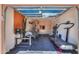 Converted garage with fitness equipment, storage cabinets, and rubber flooring at 2514 E Grand Canyon Dr, Chandler, AZ 85249