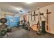 Spacious garage transformed into a complete home gym, with a Rogue power rack and weights, for fitness enthusiasts at 2514 E Grand Canyon Dr, Chandler, AZ 85249