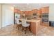 Kitchen featuring stainless steel appliances, an island with sink and bar seating at 2514 E Grand Canyon Dr, Chandler, AZ 85249