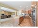 Open-concept kitchen featuring stainless steel appliances and a connected living room at 2514 E Grand Canyon Dr, Chandler, AZ 85249