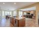 Kitchen with island that connects to dining area and living room with fireplace at 2514 E Grand Canyon Dr, Chandler, AZ 85249