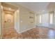 Inviting living room features neutral tones, tiled floors, and recessed lighting for a bright and airy space at 2514 E Grand Canyon Dr, Chandler, AZ 85249